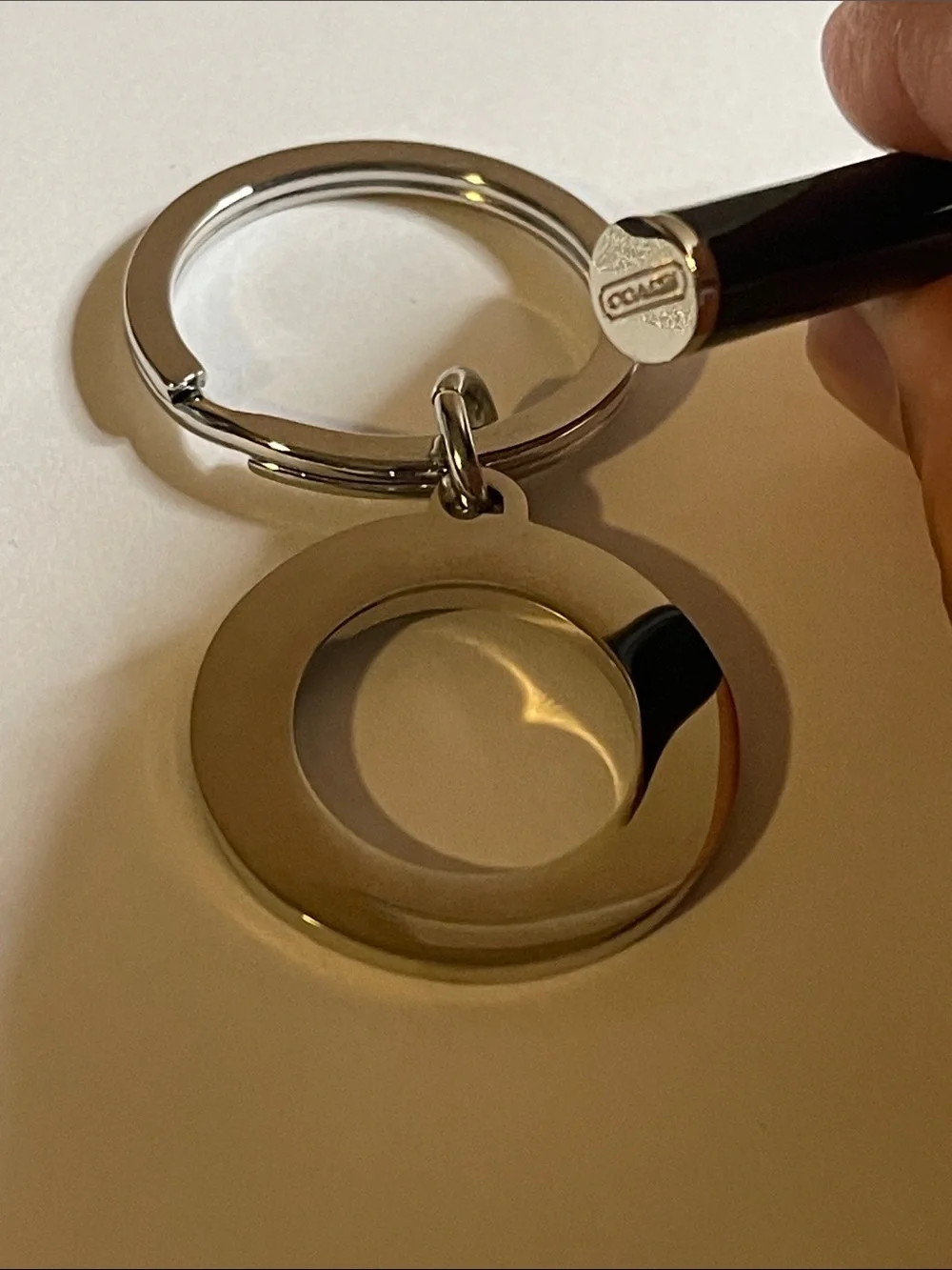 Coach Black & Silver Circular Keyring and Coach Pen